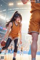 A woman in a basketball uniform holding a basketball on a court.